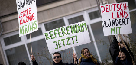 Prangern Mitverantwortung der BRD an: Proteste gegen die Besetzu...